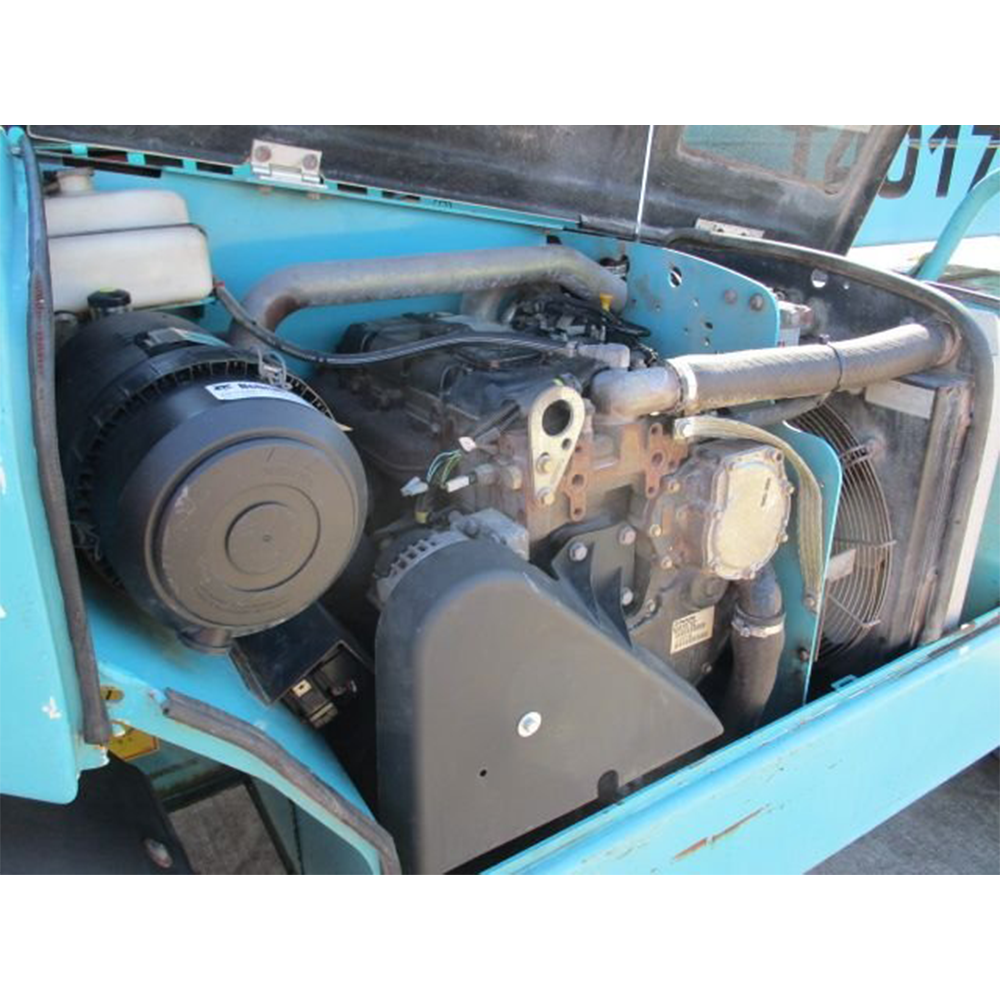 Chariot télescopique de marque JLG, modèle d’occasion, équipé d’un moteur diesel.